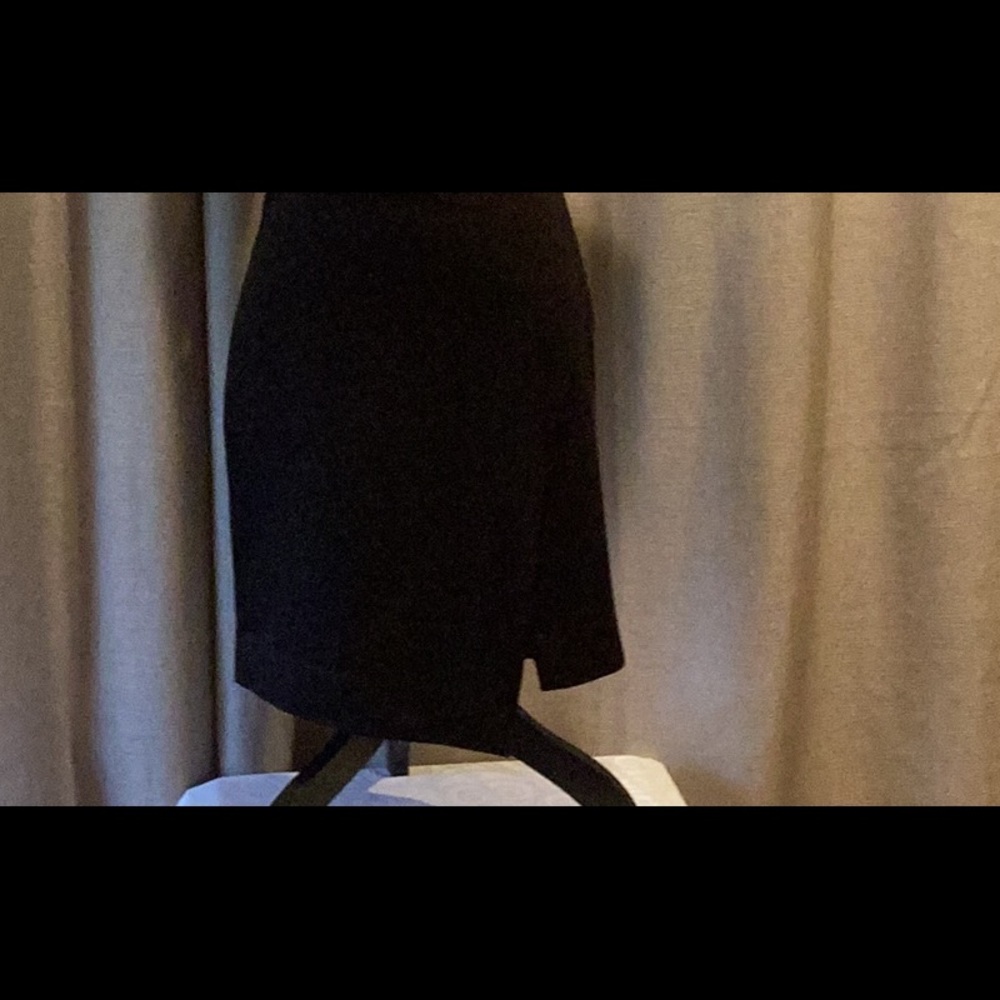 White House Black Market Black pencil skirt, asymmetrical front slit, size 8.
